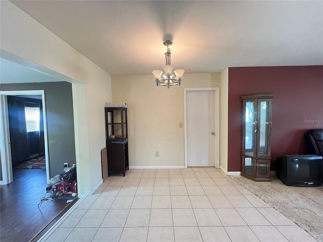 1405 Dorchester St, Port Charlotte, FL 33952 - dining room with a chandelier, baseboards, and light tile patterned floors