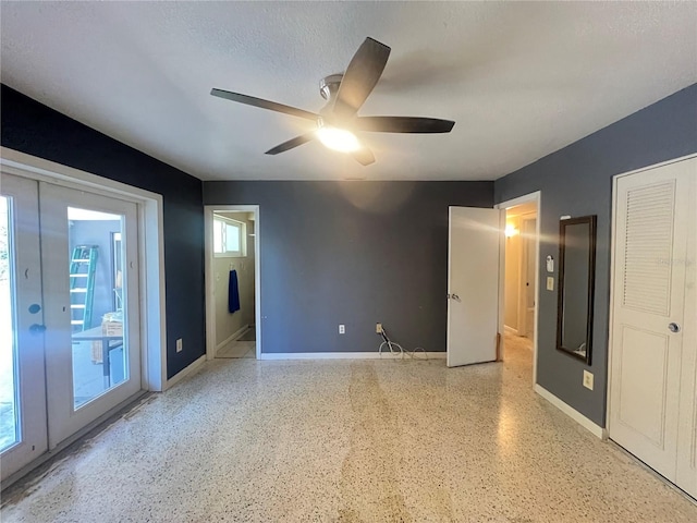 1405 Dorchester St, Port Charlotte, FL 33952 - spare room featuring ceiling fan, baseboards, and dark speckled floor