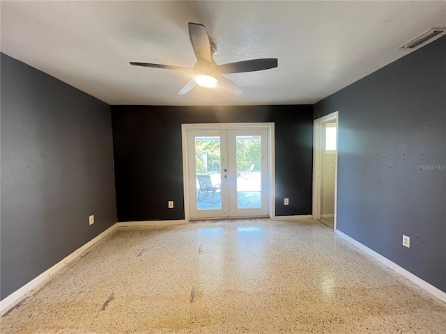 1405 Dorchester St, Port Charlotte, FL 33952 - unfurnished room with french doors, a ceiling fan, baseboards, and speckled floor