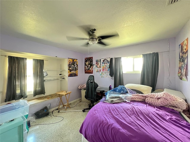 1405 Dorchester St, Port Charlotte, FL 33952 - bedroom with a textured ceiling, ceiling fan, and speckled floor