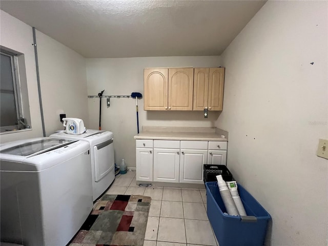 1405 Dorchester St, Port Charlotte, FL 33952 - laundry room featuring cabinet space, washing machine and clothes dryer, and light tile patterned floors