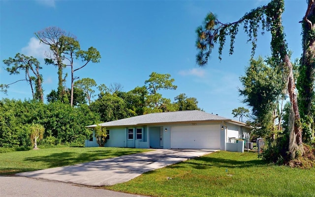 ranch-style house featuring a garage and a front lawn