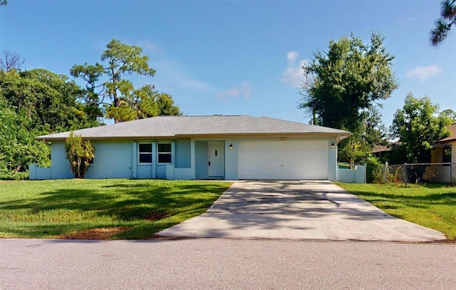 ranch-style house with a garage and a front yard