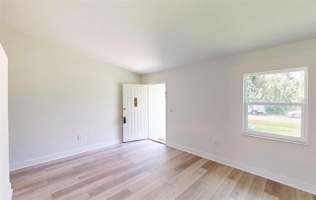 spare room with light hardwood / wood-style floors