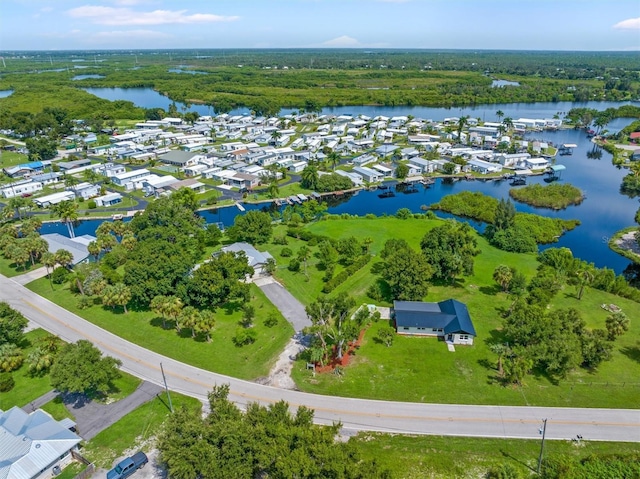 aerial view with a residential view and a water view