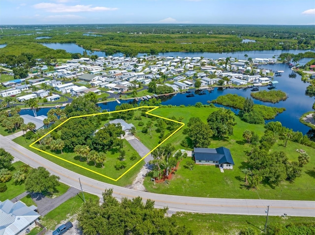 birds eye view of property with a water view