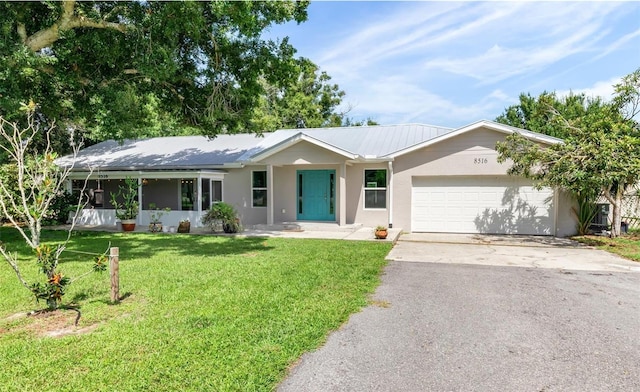 single story home with a front lawn and a garage