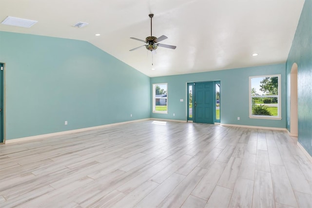 unfurnished living room with lofted ceiling, light hardwood / wood-style flooring, and ceiling fan