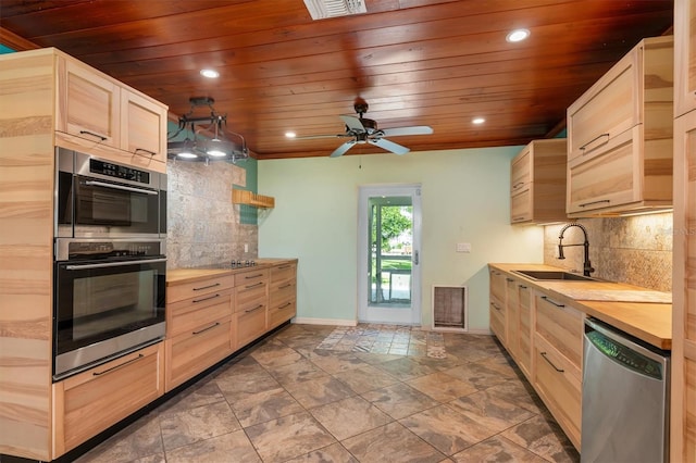 kitchen with visible vents, wooden ceiling, appliances with stainless steel finishes, light brown cabinetry, and a sink