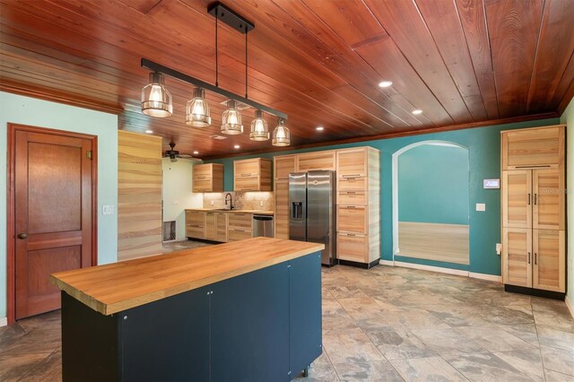 8516 Riverside Dr, Punta Gorda, FL 33982 - kitchen featuring wooden counters, arched walkways, ornamental molding, wood ceiling, and appliances with stainless steel finishes