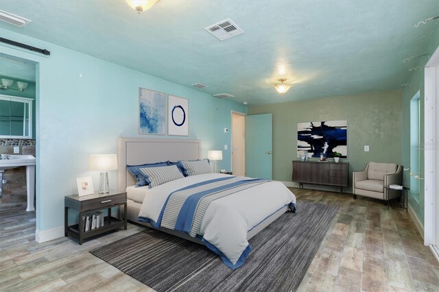 bedroom featuring wood-type flooring