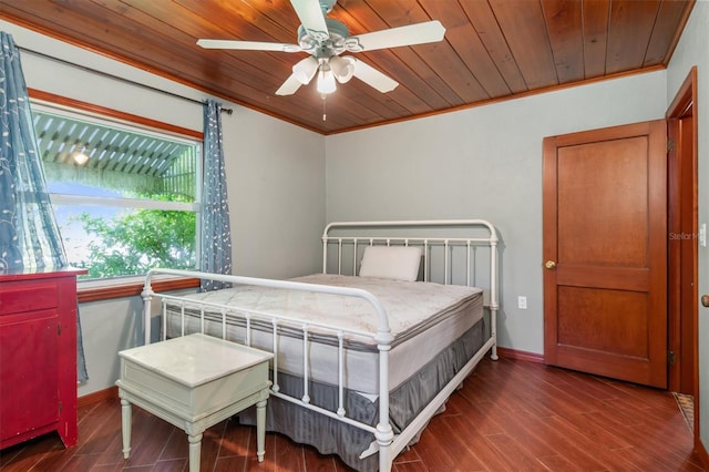 bedroom featuring ceiling fan, dark hardwood / wood-style floors, and ornamental molding