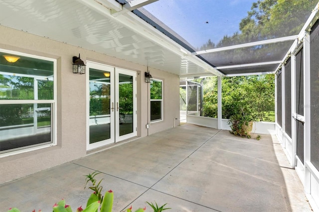 view of patio with a lanai and french doors