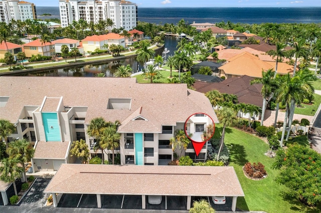 birds eye view of property featuring a water view