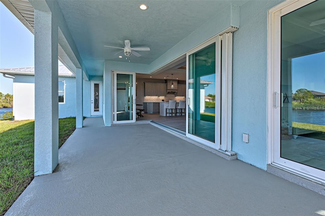 view of patio featuring ceiling fan