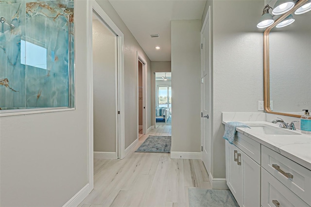 bathroom featuring vanity and hardwood / wood-style floors