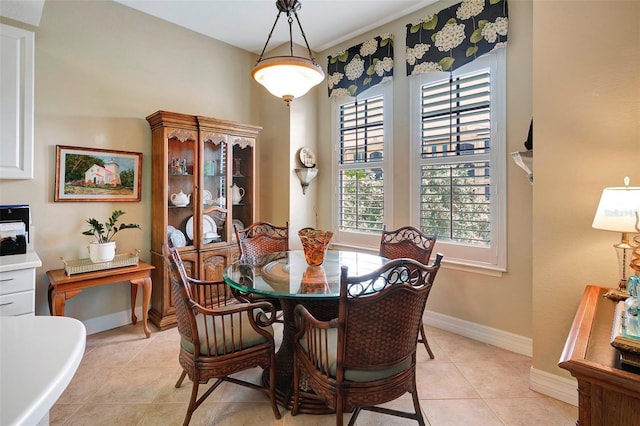 tiled dining area with crown molding