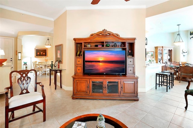 tiled living room featuring ceiling fan and crown molding