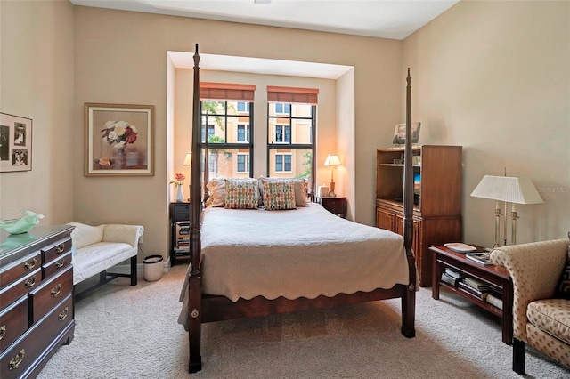 bedroom featuring light carpet