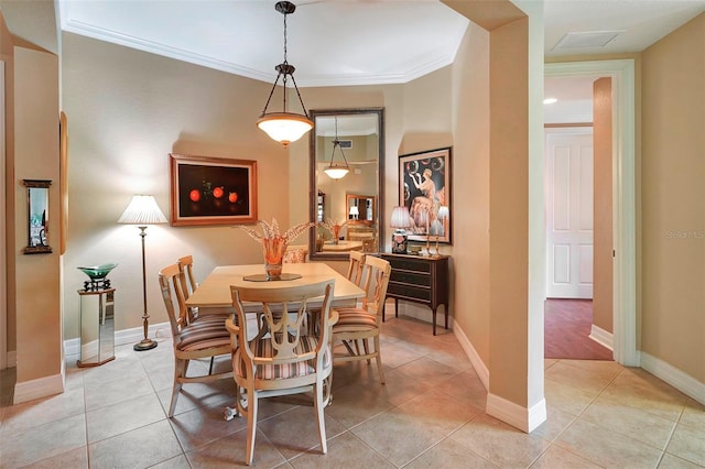 dining area with light hardwood / wood-style floors and ornamental molding