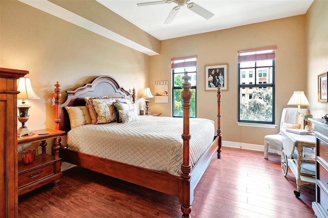 bedroom with ceiling fan and hardwood / wood-style flooring