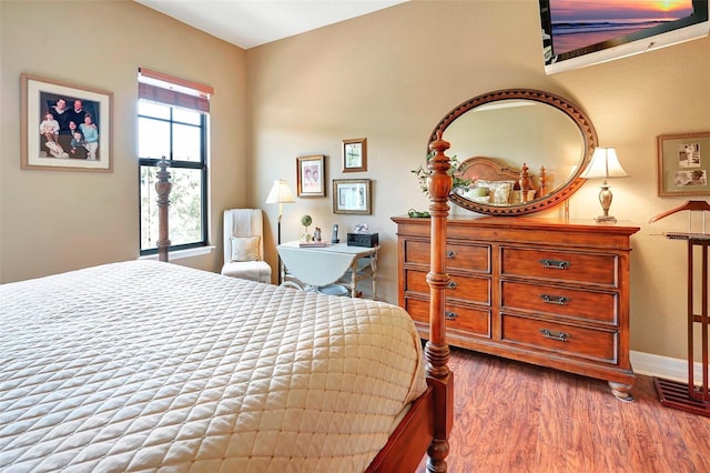 bedroom with wood-type flooring