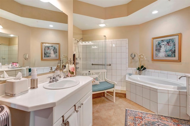 bathroom featuring tile patterned flooring, separate shower and tub, and vanity