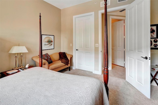 bedroom featuring a closet and light colored carpet