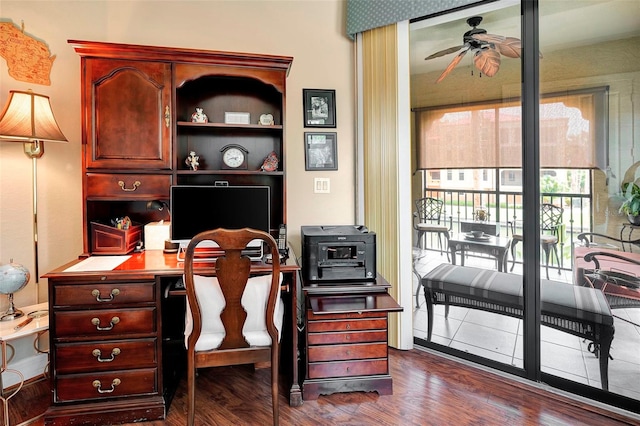 office area with ceiling fan and dark wood-type flooring