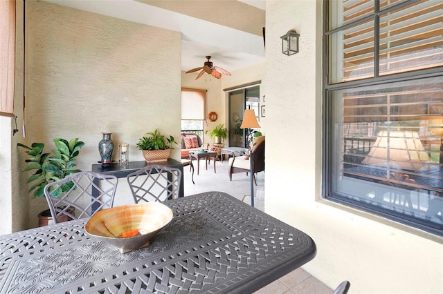 view of patio / terrace featuring ceiling fan