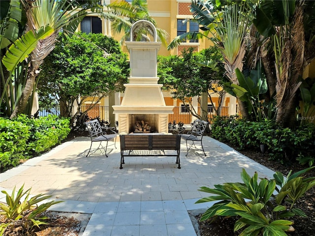 view of patio / terrace with exterior fireplace