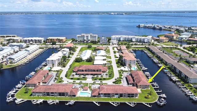 birds eye view of property with a water view