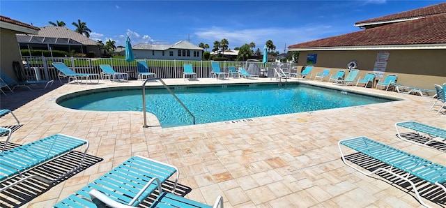 view of swimming pool with a patio