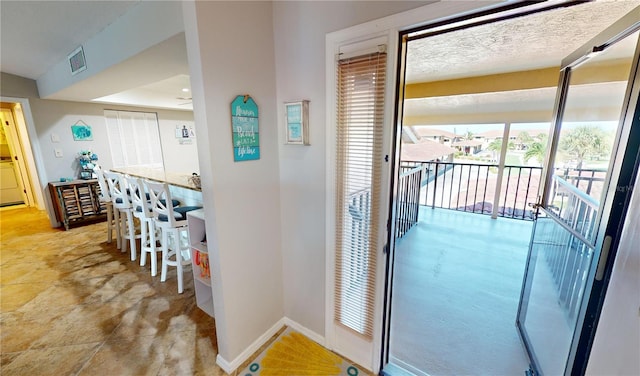 hallway featuring light tile patterned flooring