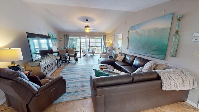 tiled living room featuring lofted ceiling and ceiling fan