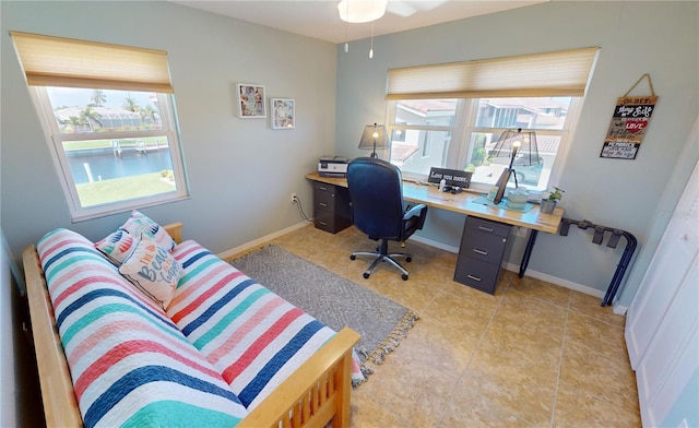 tiled office space with ceiling fan