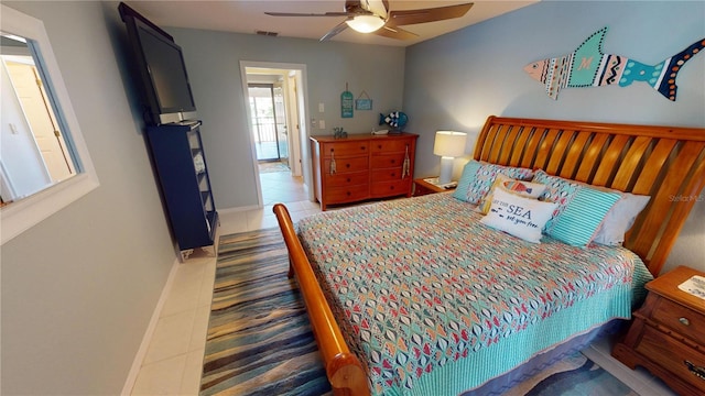 tiled bedroom with ceiling fan