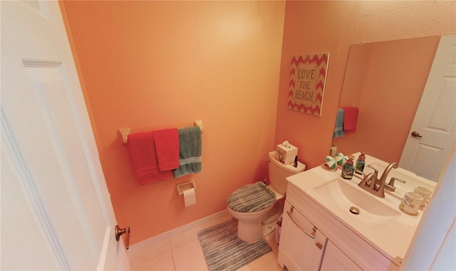 bathroom featuring vanity, toilet, and tile patterned floors