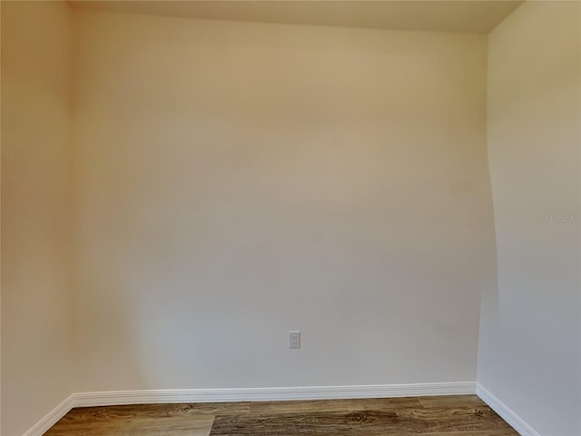 spare room featuring hardwood / wood-style floors