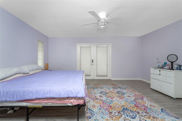 bedroom featuring light hardwood / wood-style floors and ceiling fan