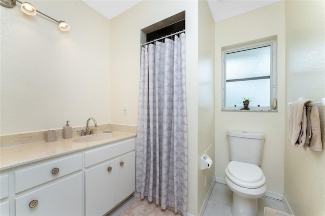 full bath featuring curtained shower, tile patterned flooring, toilet, vanity, and baseboards