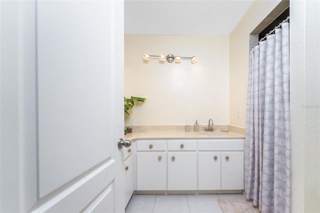 full bathroom featuring vanity and tile patterned floors