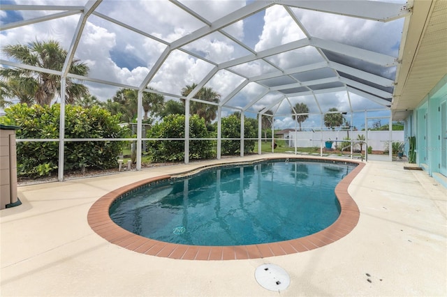 view of swimming pool featuring a patio, a lanai, and a fenced in pool