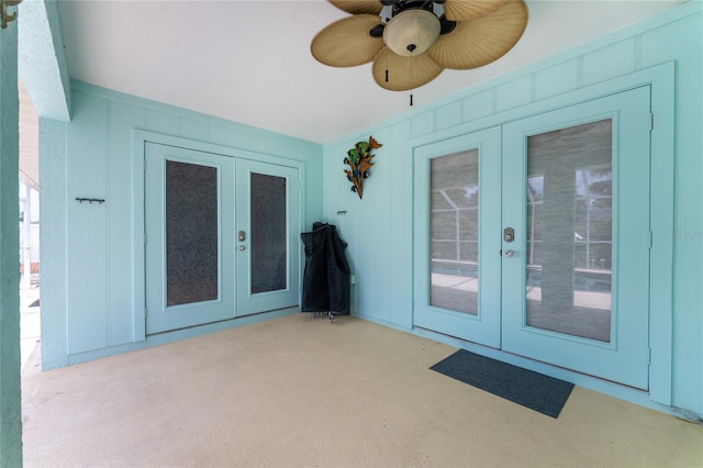 entrance to property featuring french doors, ceiling fan, and a patio area