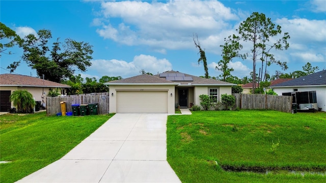 ranch-style house with solar panels, a garage, and a front yard