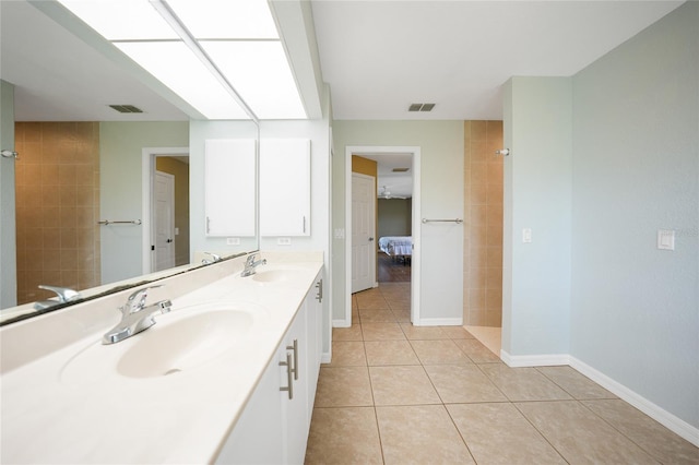 bathroom featuring tile patterned flooring, visible vents, and a sink