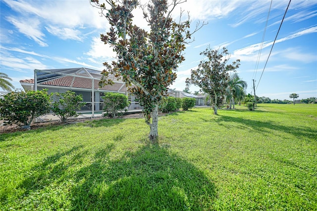 view of yard featuring glass enclosure