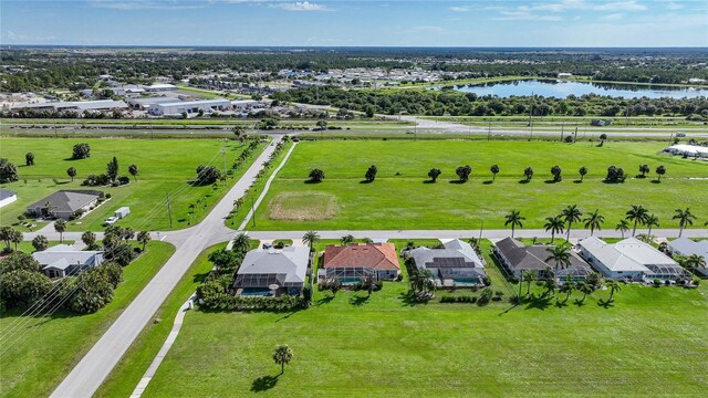 bird's eye view with a water view and a residential view