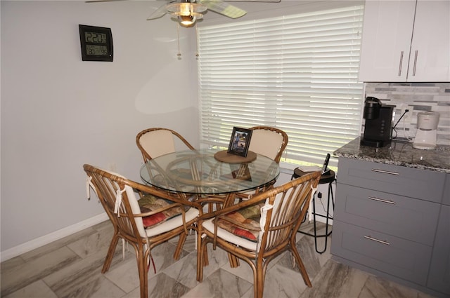 dining area featuring light tile patterned floors and ceiling fan