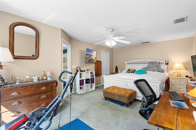 bedroom with carpet, visible vents, ceiling fan, and a closet